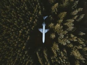 Reducing carbon footprint with virtual solutions a plane in the forest